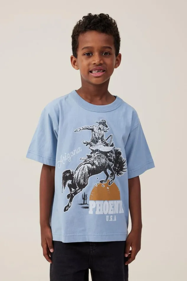 Jonny Short Sleeve Print Tee Dusty Bluephoenix Cowboy Boys Cotton On Tops and TShirts Jonny Short Sleeve Print Tee Dusty Bluephoenix Cowboy Boys Cotton On Tops and TShirts