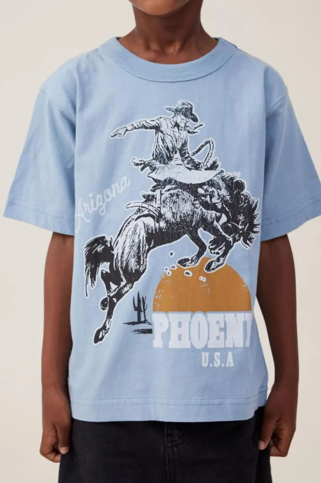 Jonny Short Sleeve Print Tee Dusty Bluephoenix Cowboy Boys Cotton On Tops and TShirts Jonny Short Sleeve Print Tee Dusty Bluephoenix Cowboy Boys Cotton On Tops and TShirts